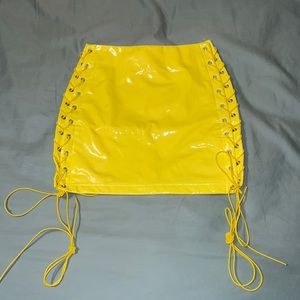 Yellow lace up vinyl skirt